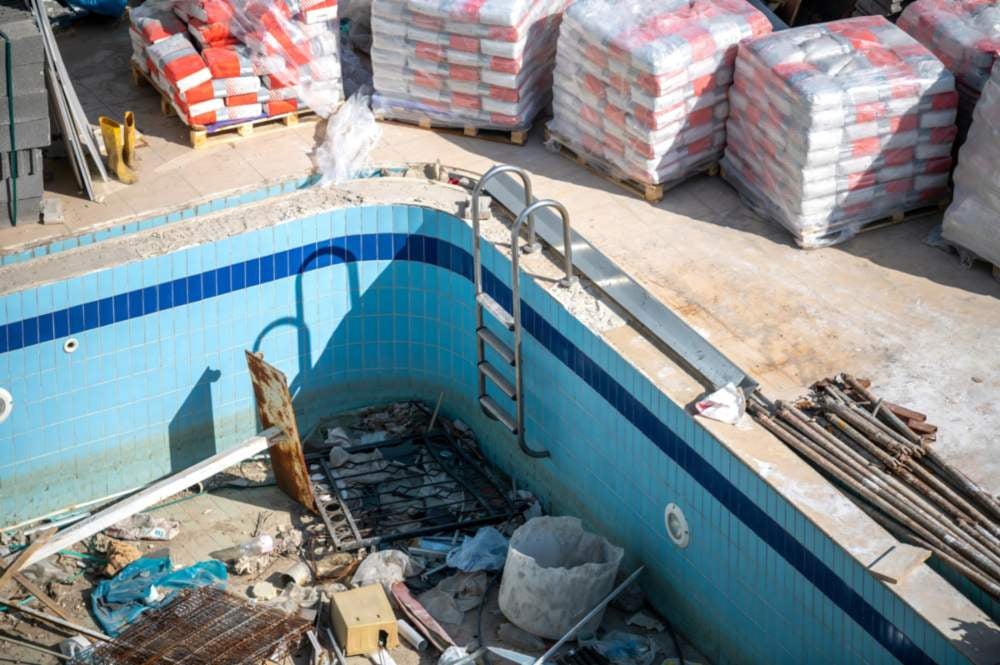 Renovating old swimming pool with latest functional equipment and cosmetic enhancements